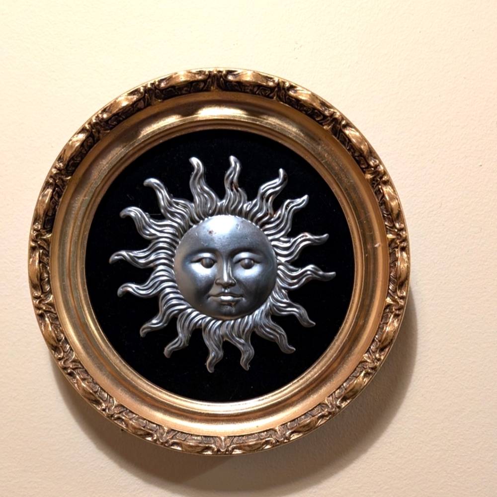 Sun face wall art silver round gold frame on black velvet. Slays
